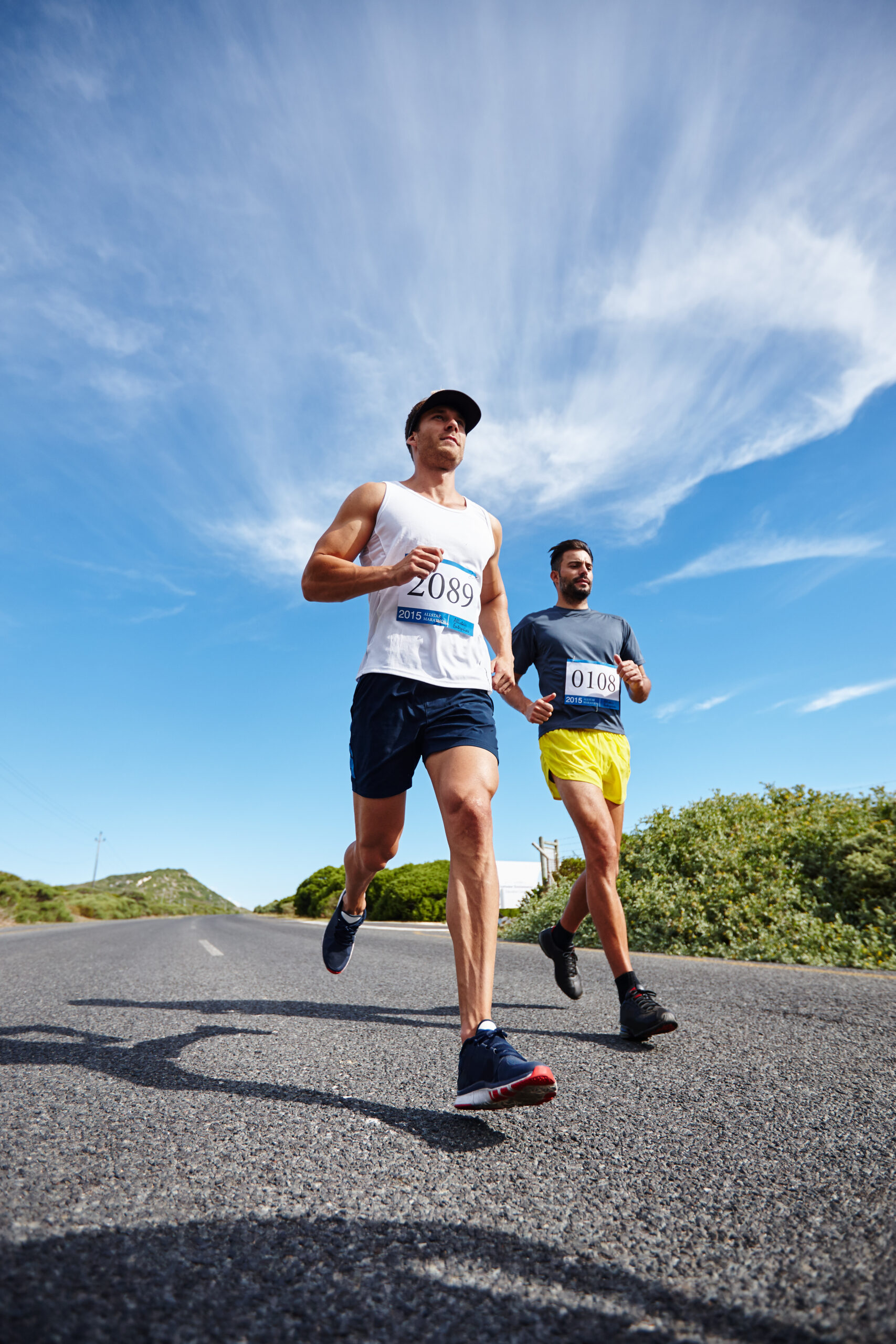 Shot of a group of young men running a marathon.